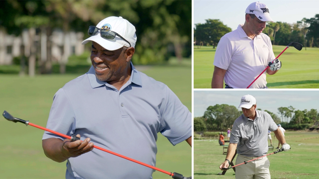 Golfers happily looking at The Straight Stick while on the course.