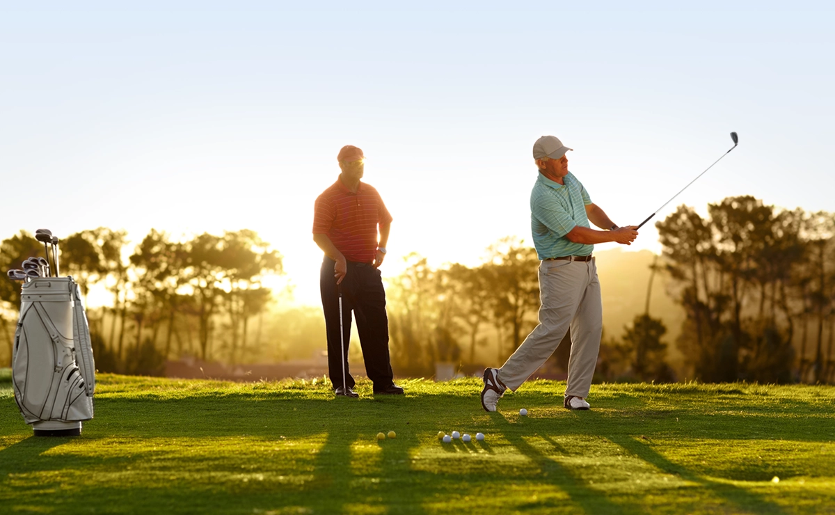 Two golfers on a course.
