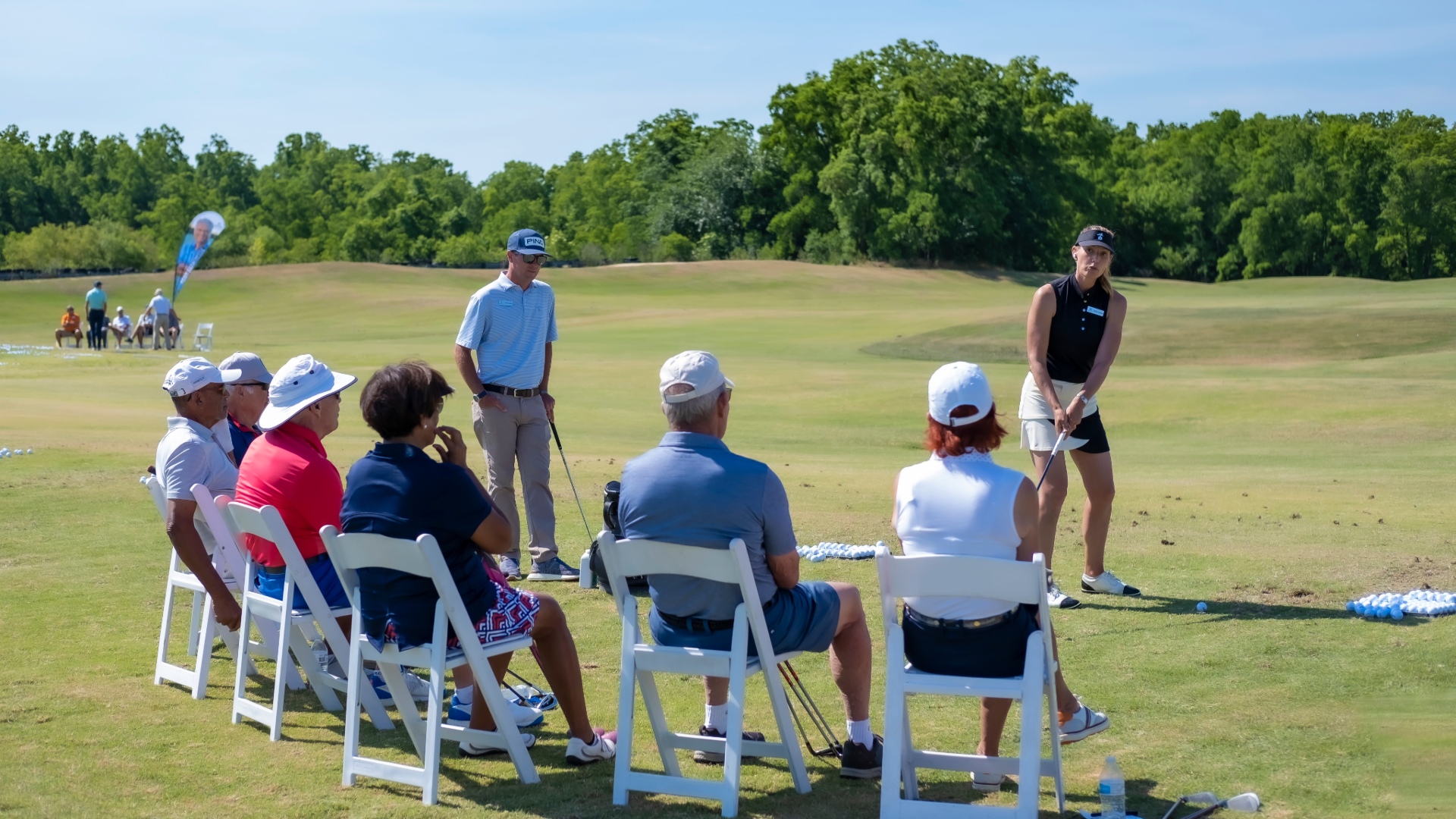 Performance Golf coach Erika Larkin demonstrating to a small group of golfers during a 2 day golf school experience.