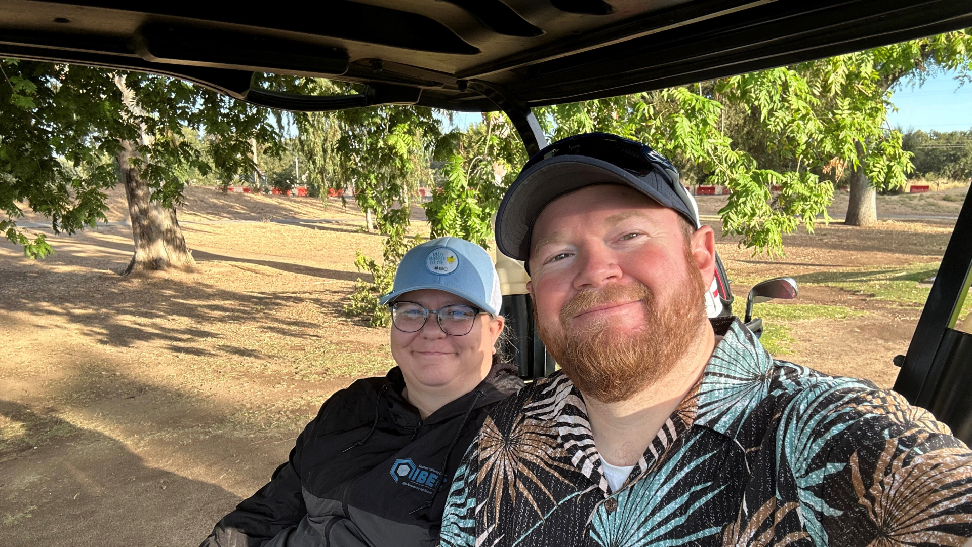 VIP Golf School student Shawn LeCrone and his wife in a golf cart.