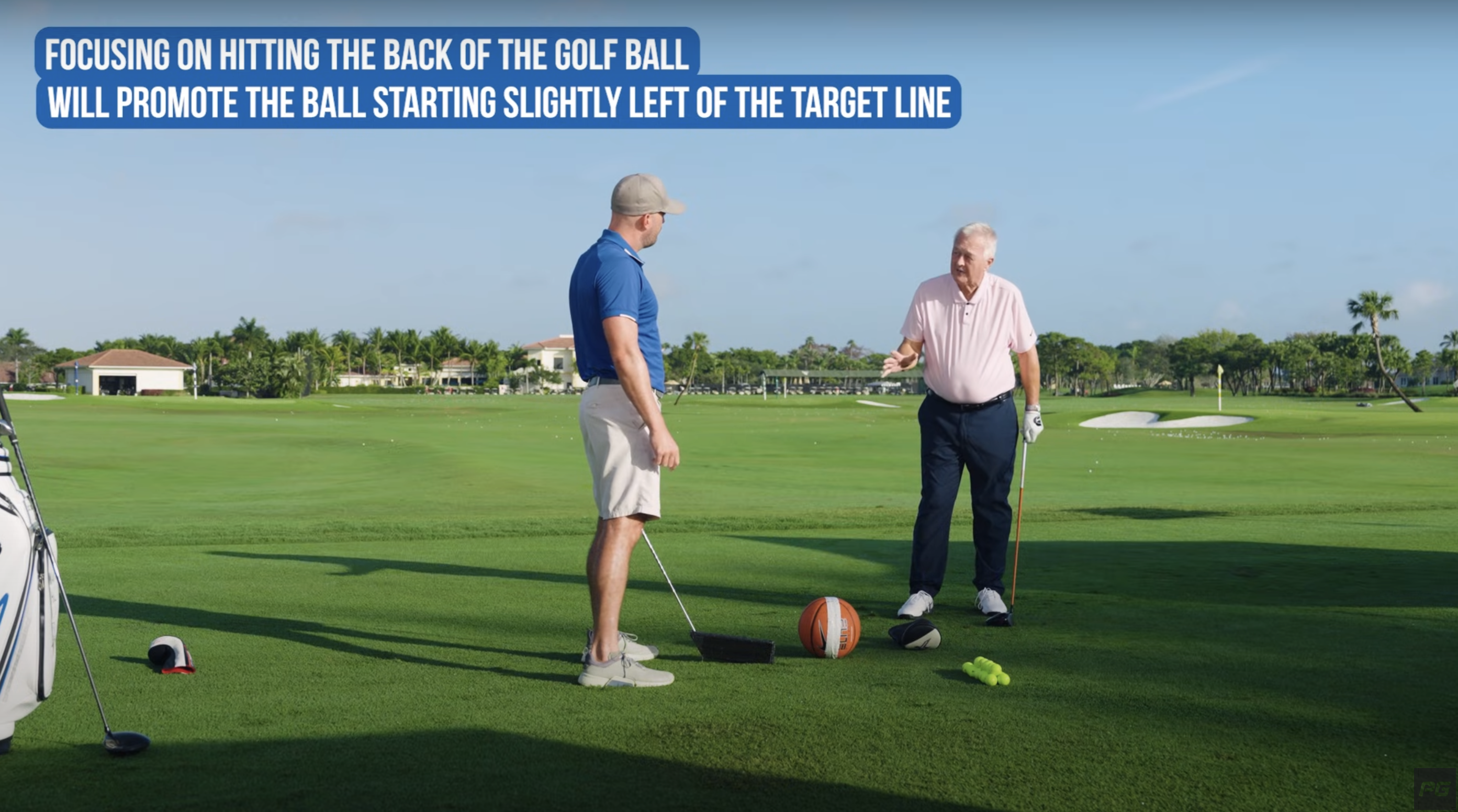 Martin Hall using a basketball on the golf course as a visual to show how to accurately direct your fade golf swing.