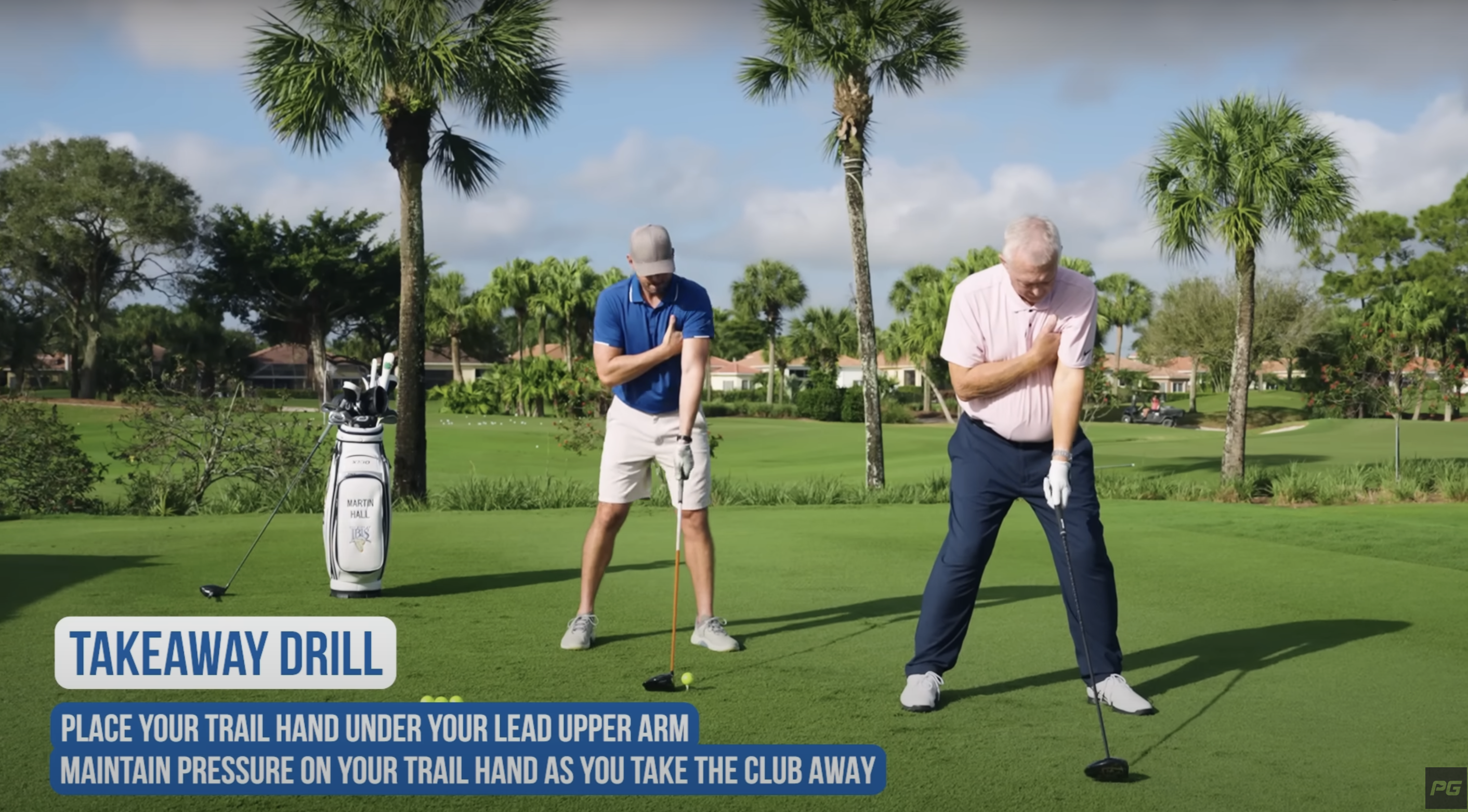 Golf coach Martin Hall demonstrates a takeaway drill with Eric Cogorno on the golf course.