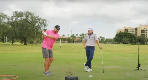 Golf coach Cameron McCormick giving a live lesson to a beginner golfer.