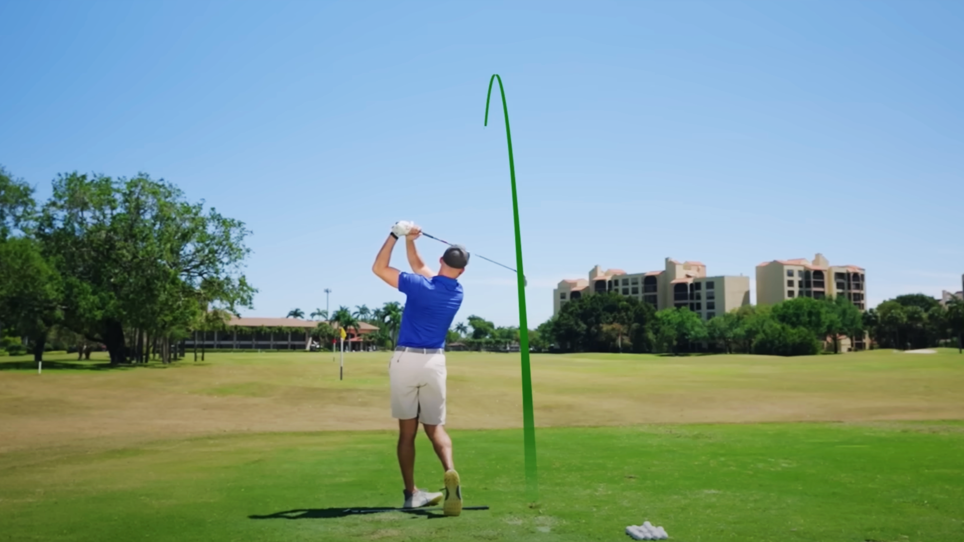 Performance Golf coach showcasing a straight, long golf swing on the course.