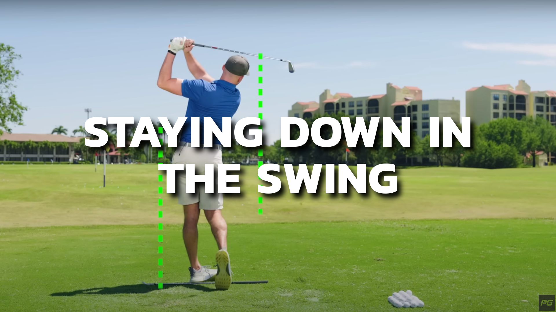 ALT TEXT: Golf coach showing the proper setup and golf swing stance to stay down in the golf swing for more consistent hits.
