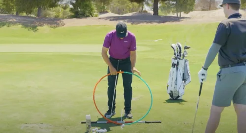 Golf coach Martin Chuck using multiple tools to show where the true bottom of the golf swing is, and how you can use a simple drill to make better contact.