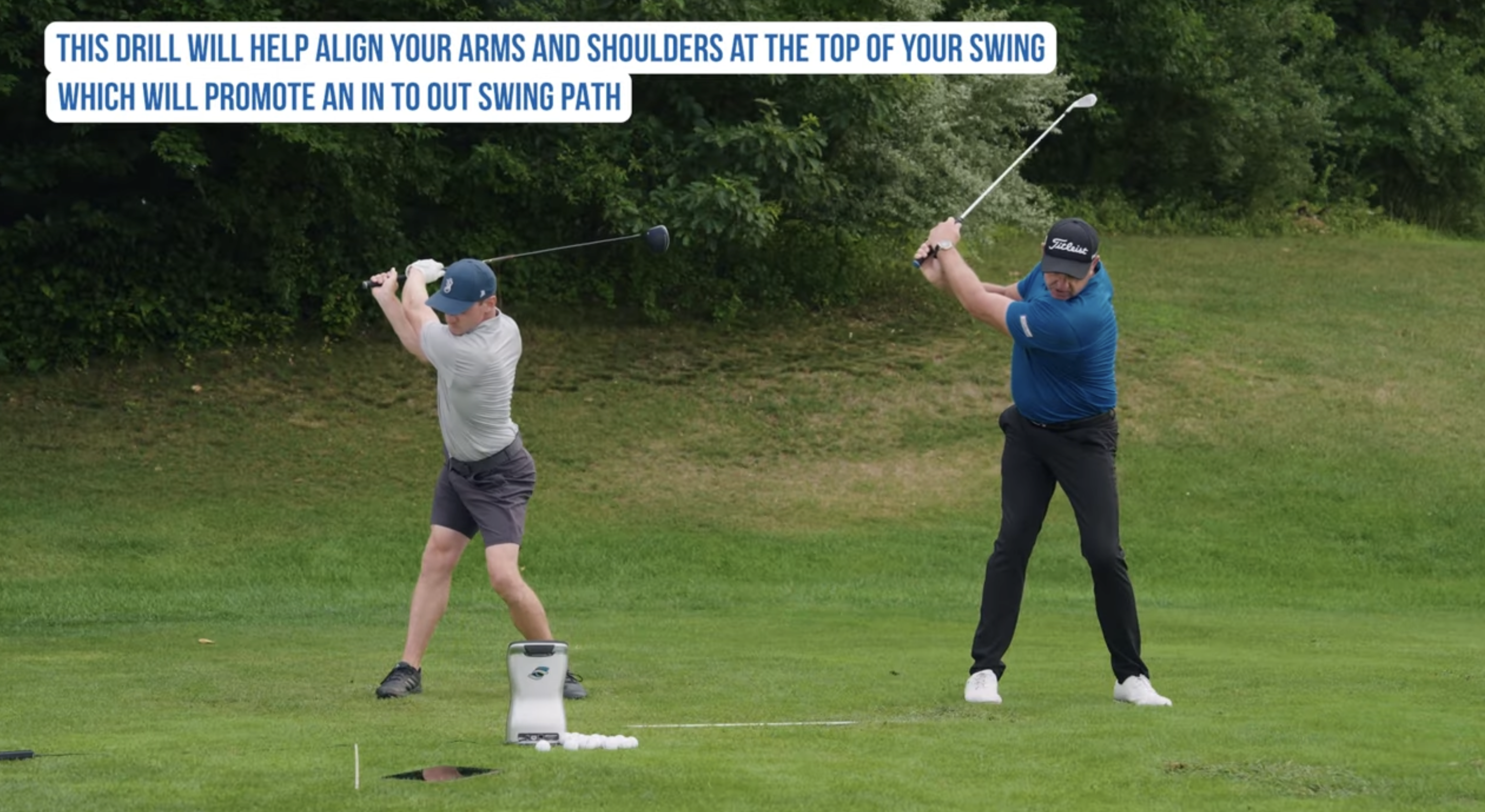 Performance Golf coach on the right, showcasing how to align your arms and shoulders at the top of the golf swing.