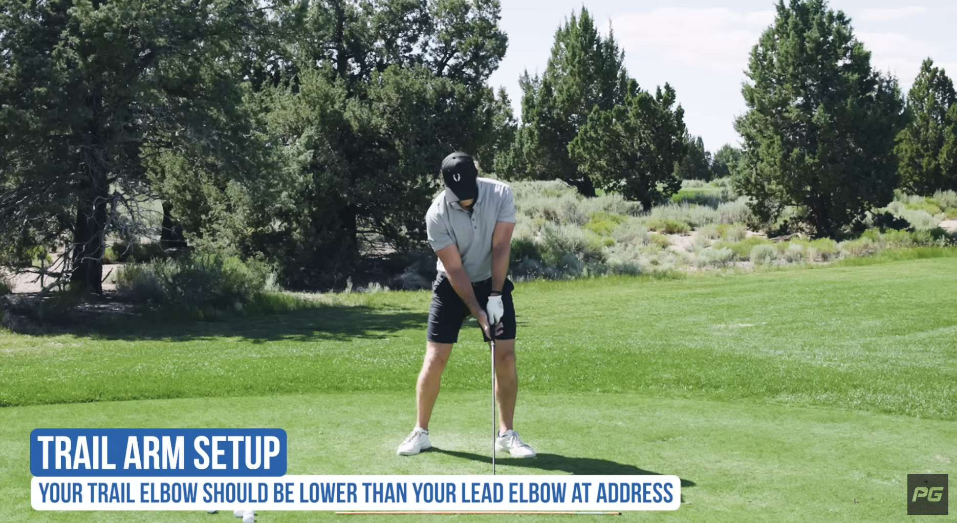 Coach Jeff Ritter showing the proper trail arm setup in the golf swing setup.