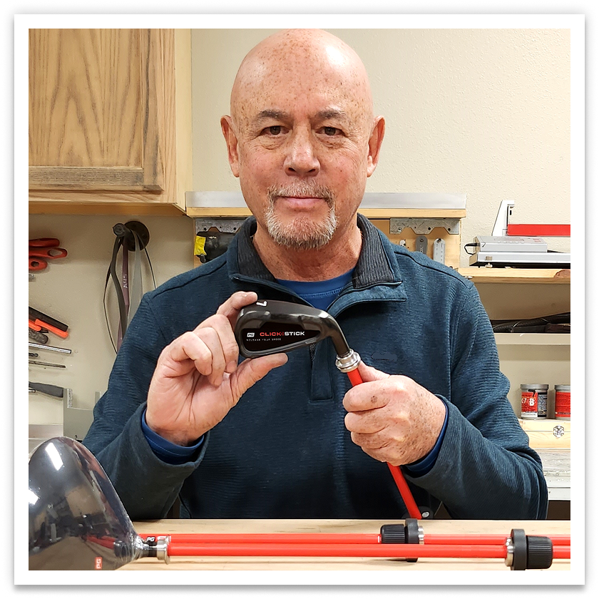 Hank Haney holding the SF1 and pointing to it